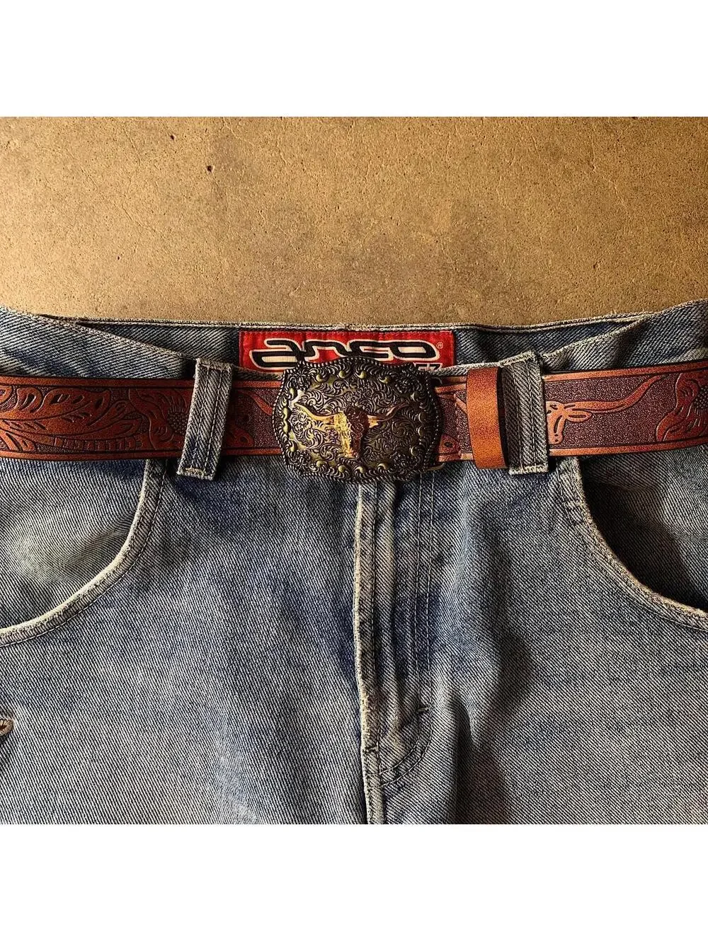 American Western Brown leather belt with silver-toned brass buckle, featuring a